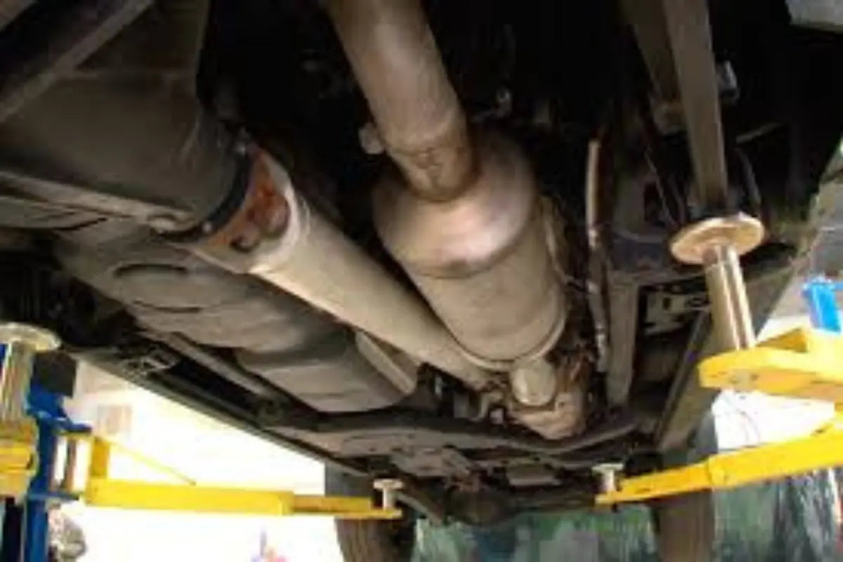 Mechanic pointing at DPF components while explaining delete options